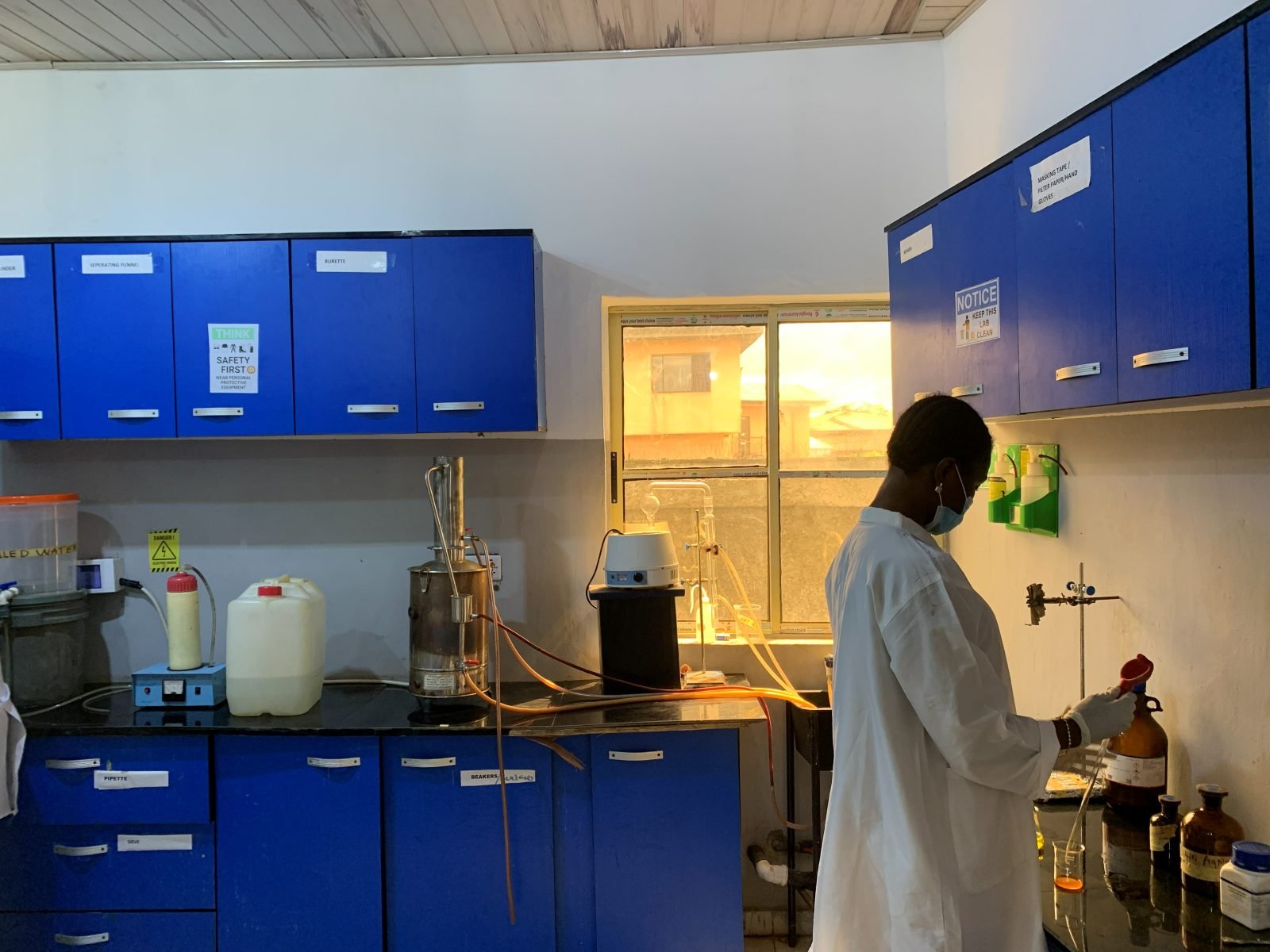 Analyst operating a distillation set-up in the Quatenary laboratory