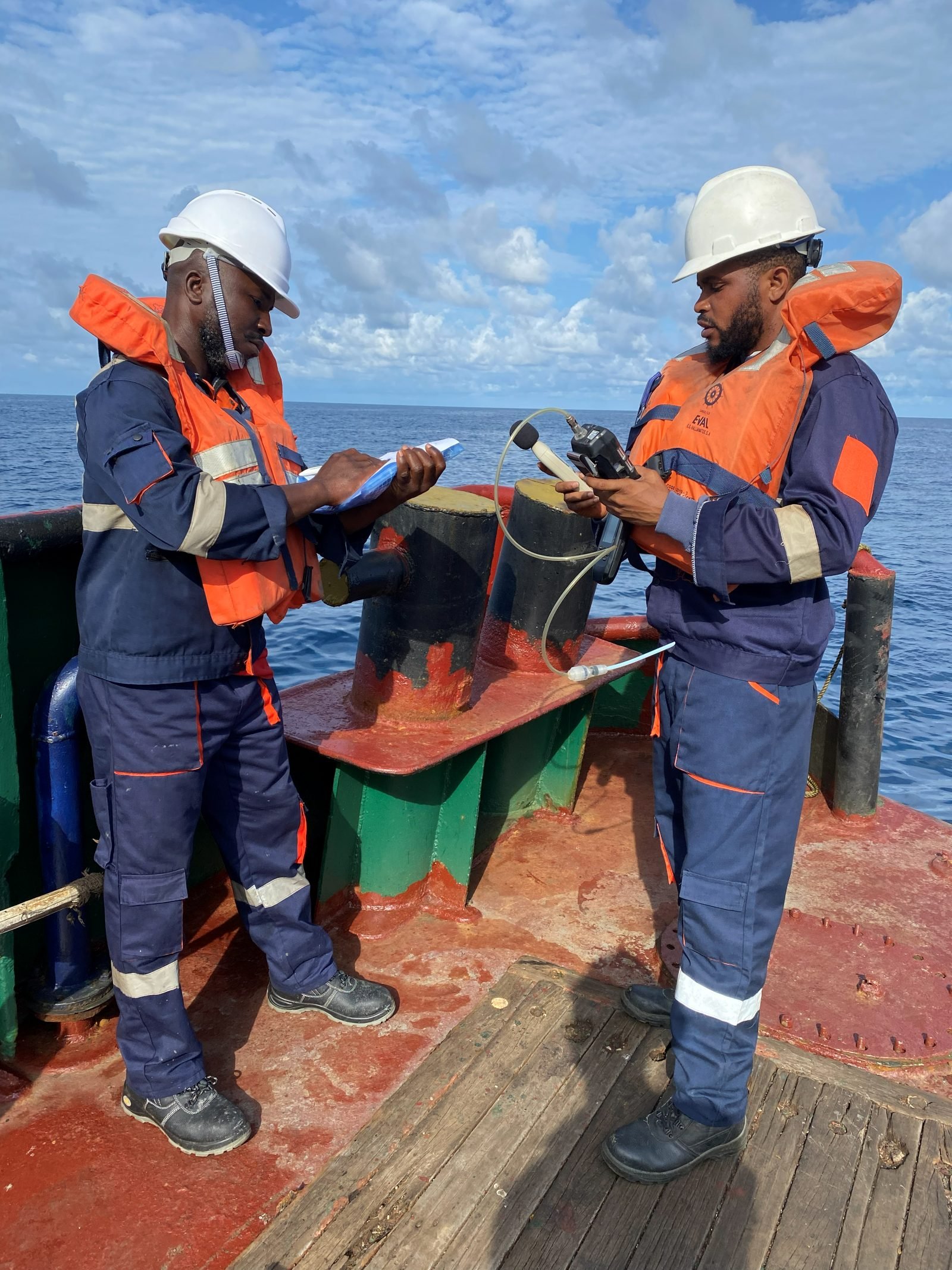 Two engineers taking noise measurements on an offshore vessel